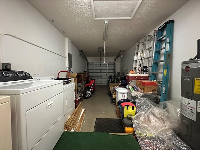 garage with independent washer and dryer and electric water heater