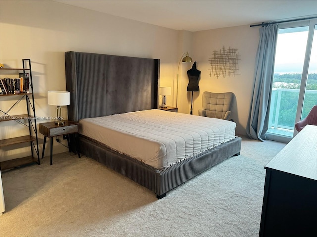 bedroom featuring light carpet