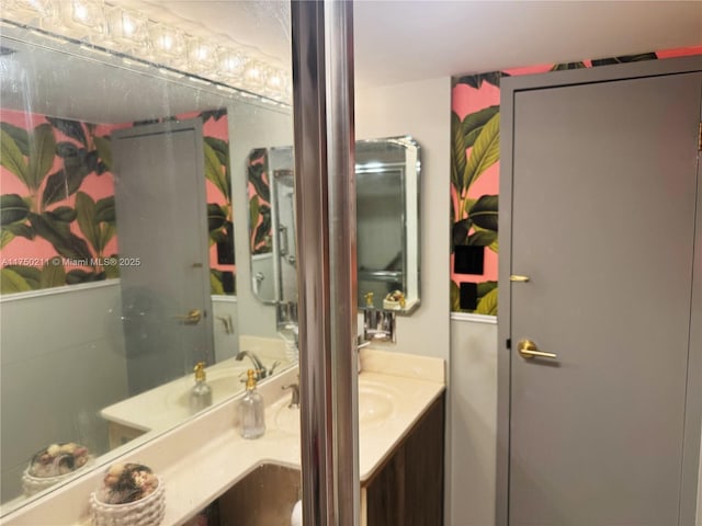 bathroom featuring an enclosed shower and vanity