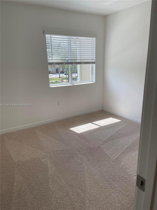 2435 SE 11th St, Homestead, FL 33035 - carpeted spare room with baseboards