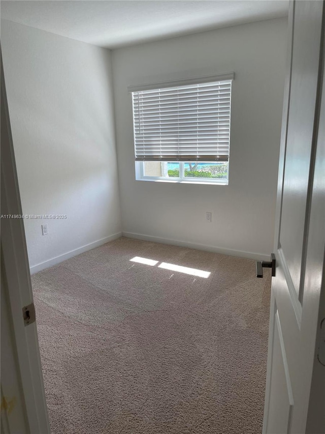 2435 SE 11th St, Homestead, FL 33035 - carpeted spare room featuring baseboards