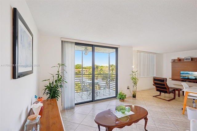 900 Colony Point Cir Unit 408, Pembroke Pines, FL 33026 - living room with light tile patterned floors, floor to ceiling windows, and a textured ceiling