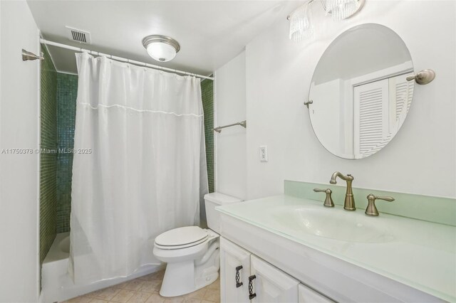 full bath featuring vanity, toilet, tile patterned floors, shower / tub combo, and visible vents