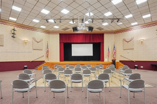 cinema with a drop ceiling and wallpapered walls