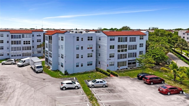 view of property featuring uncovered parking