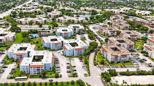 aerial view featuring a water view and a view of city