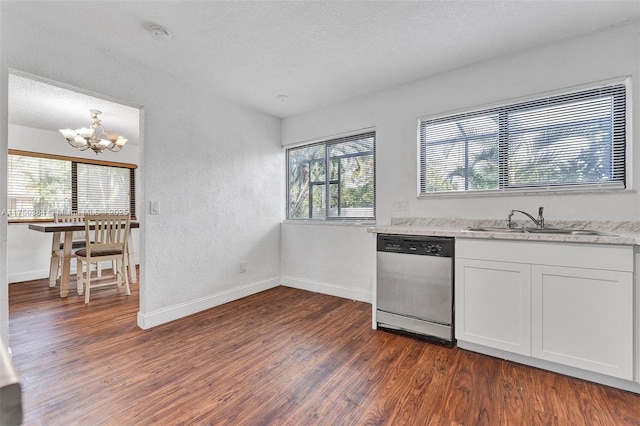 kitchen featuring a sink, dark wood-style floors, white cabinets, and stainless steel dishwasher