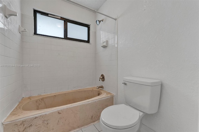 full bath featuring shower / tub combination, toilet, and tile patterned floors