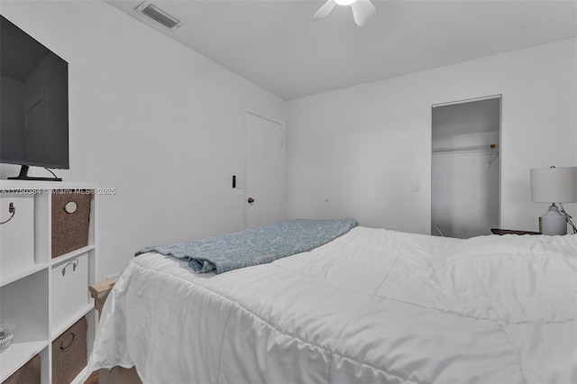 bedroom with a closet, visible vents, and ceiling fan