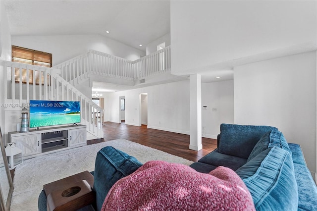 living area with baseboards, stairway, wood finished floors, high vaulted ceiling, and recessed lighting