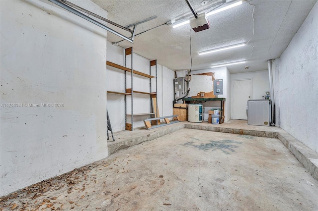 garage with a garage door opener and electric panel