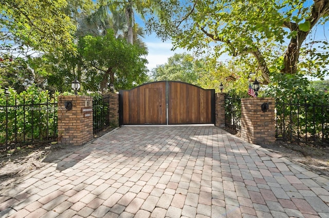 view of gate with fence