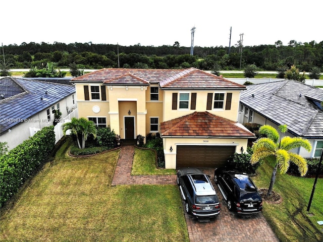 view of front facade featuring a garage, stucco siding, decorative driveway, and a front yard