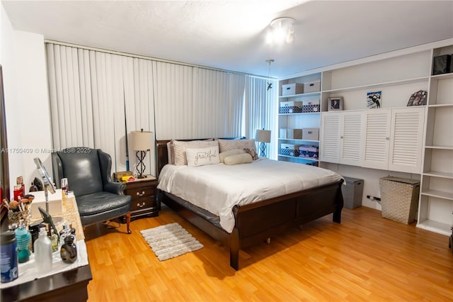 bedroom with wood finished floors