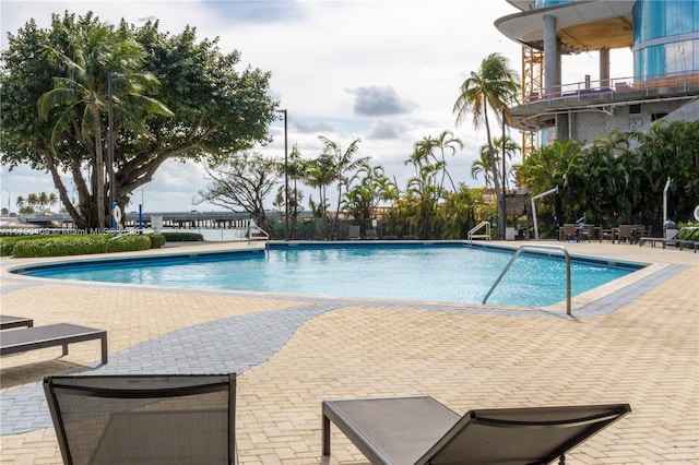 community pool with a patio area