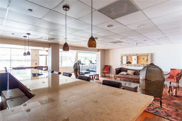 dining area with a drop ceiling