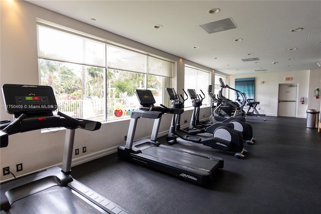 workout area featuring baseboards and recessed lighting