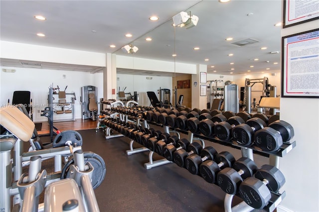 workout area with visible vents and recessed lighting