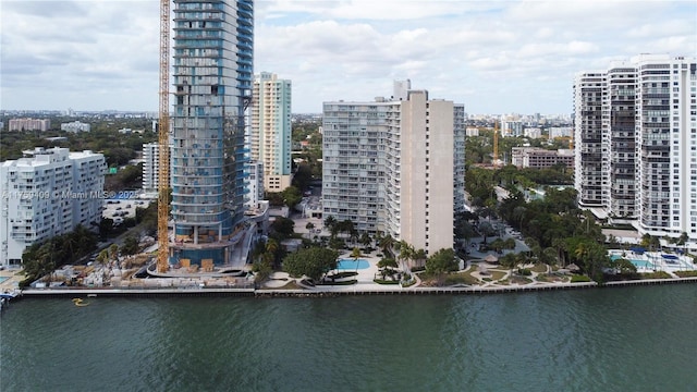 birds eye view of property featuring a water view and a city view