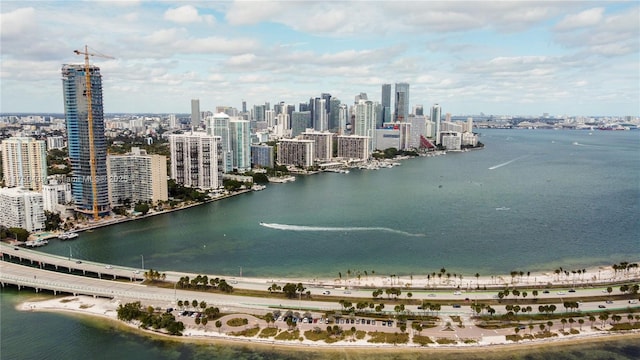 birds eye view of property featuring a water view and a city view