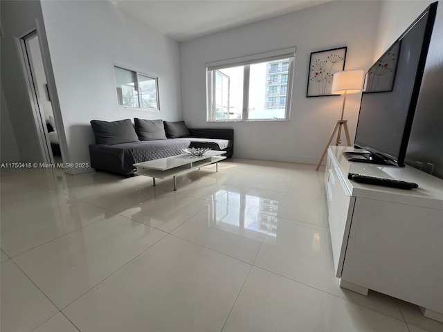 living area featuring light tile patterned floors