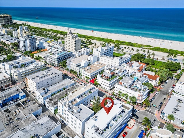 bird's eye view featuring a view of the beach, a water view, and a view of city