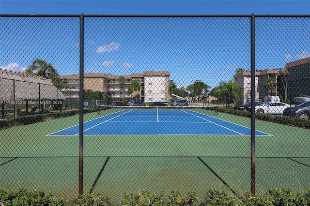 view of sport court with fence