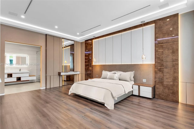 bedroom featuring wood finished floors