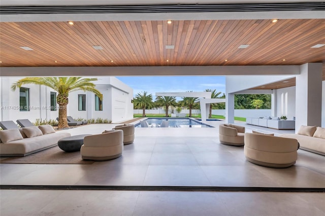 view of patio / terrace with an outdoor pool and an outdoor hangout area