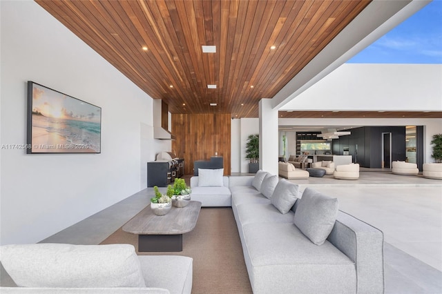 living room with wood ceiling and recessed lighting