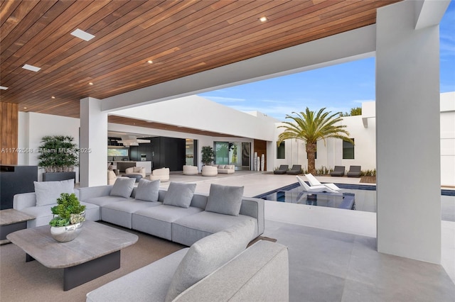 view of patio / terrace featuring outdoor lounge area and an outdoor pool