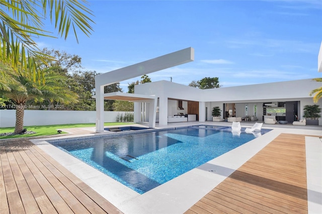 view of pool featuring fence, a fenced in pool, and a wooden deck