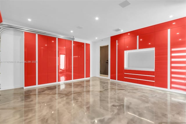 empty room featuring marble finish floor, visible vents, and recessed lighting