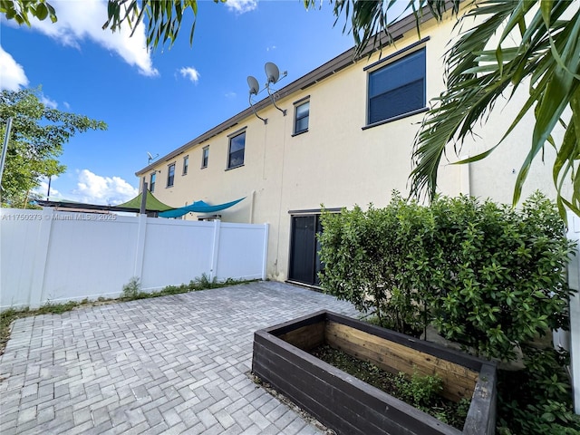 view of patio / terrace featuring fence