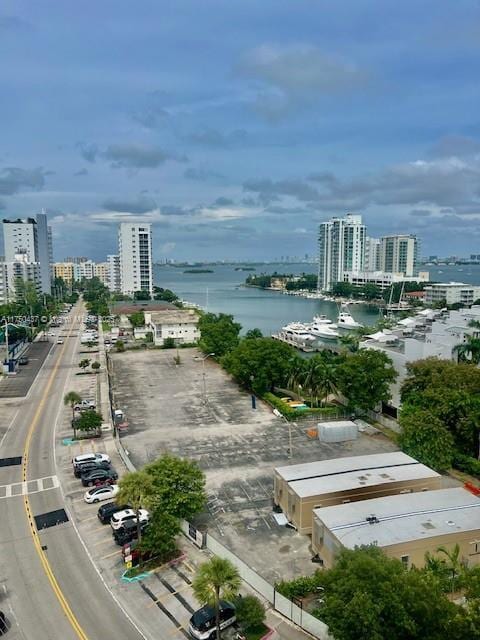 aerial view featuring a water view and a city view