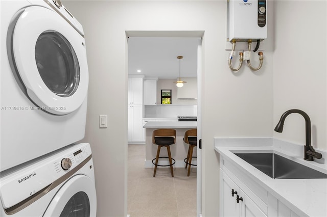 22274 SW 61st Ave, Boca Raton, FL 33428 - washroom with estacked washer and dryer, recessed lighting, and water heater