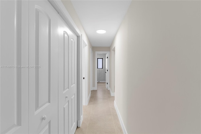 22274 SW 61st Ave, Boca Raton, FL 33428 - hall featuring light tile patterned flooring and baseboards