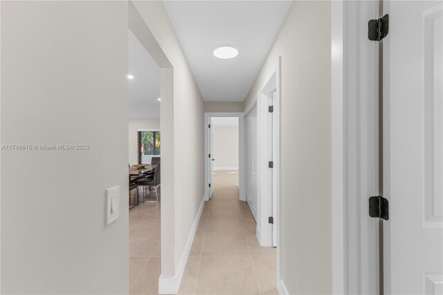 22274 SW 61st Ave, Boca Raton, FL 33428 - hall featuring light tile patterned floors and baseboards