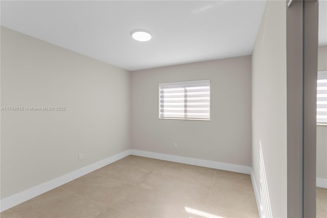 22274 SW 61st Ave, Boca Raton, FL 33428 - spare room with light tile patterned floors and baseboards