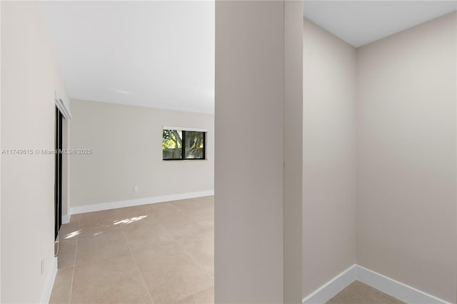 22274 SW 61st Ave, Boca Raton, FL 33428 - spare room with light tile patterned flooring and baseboards