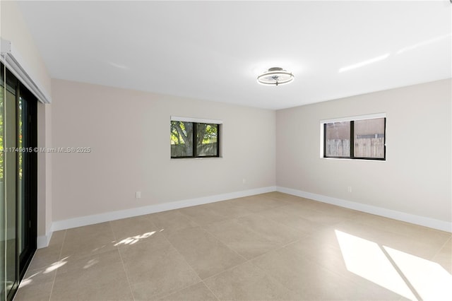 22274 SW 61st Ave, Boca Raton, FL 33428 - tiled empty room featuring baseboards