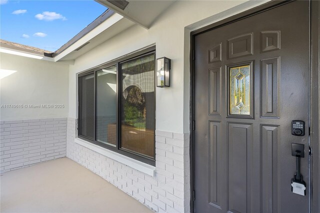 22274 SW 61st Ave, Boca Raton, FL 33428 - view of exterior entry featuring brick siding and stucco siding