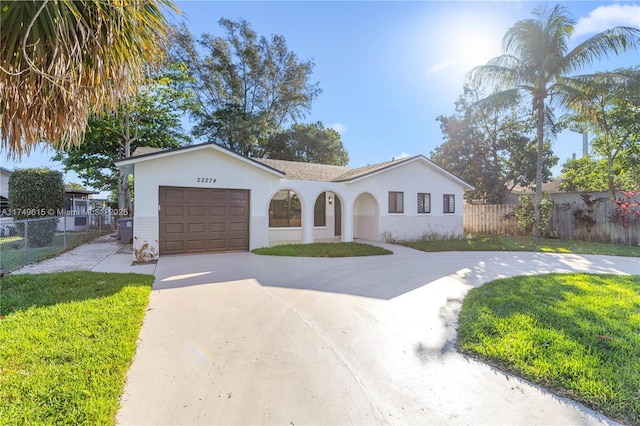 22274 SW 61st Ave, Boca Raton, FL 33428 - view of front of property featuring a garage, stucco siding, and driveway