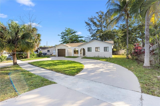 22274 SW 61st Ave, Boca Raton, FL 33428 - mediterranean / spanish-style home with concrete driveway, stucco siding, and a garage