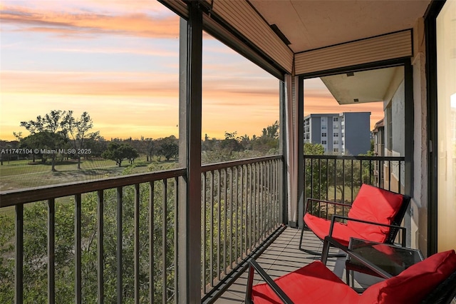 view of balcony at dusk