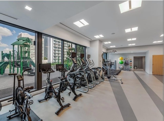 exercise room featuring expansive windows