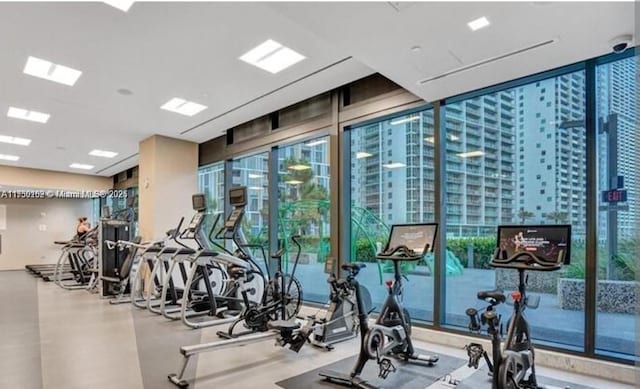 exercise room with floor to ceiling windows