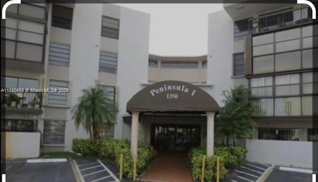 1350 SW 122nd Ave Unit 317, Miami, FL 33184 - view of building exterior with uncovered parking