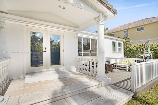 entrance to property with french doors and a deck