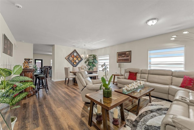living area featuring dark wood-style floors and baseboards